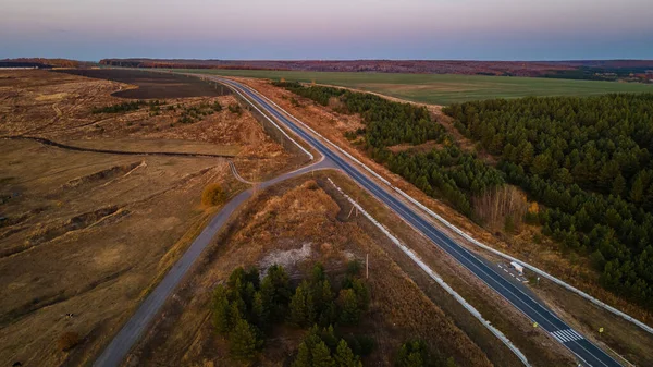 a highway that runs through rural areas in the Russian hinterland