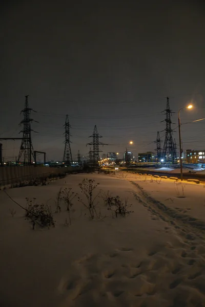poles of power lines in the dark in the city of Khimki. High quality photo
