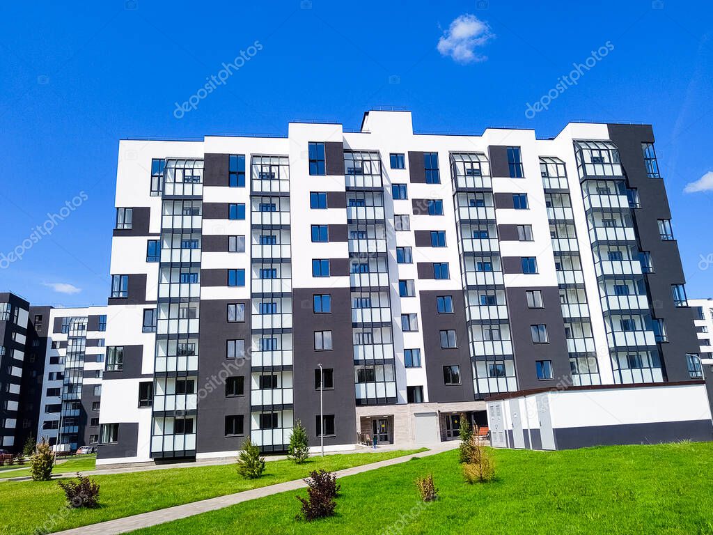 New modern apartment building opposite blue sky