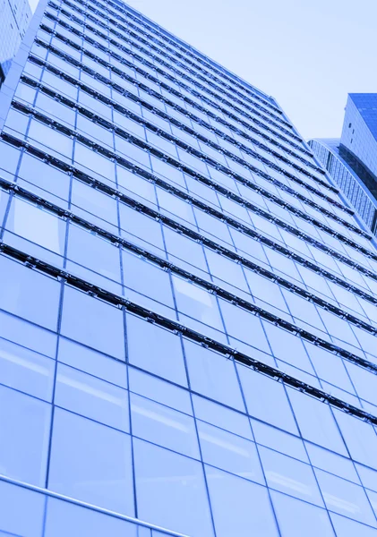Perspective wide angle view to blue glass building skyscraper — Stock Photo, Image