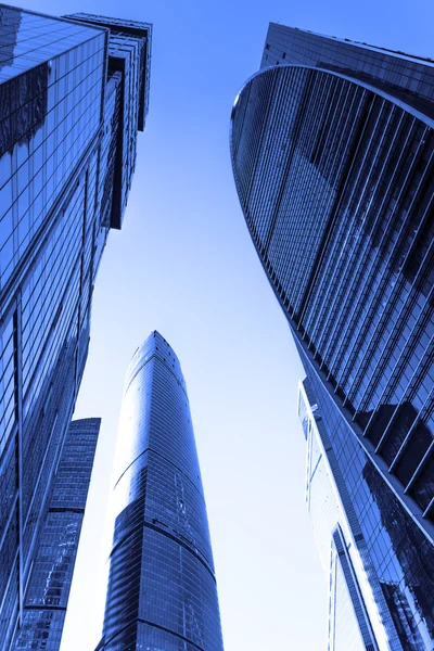 Perspective wide angle view to blue glass building skyscrapers — Stock Photo, Image