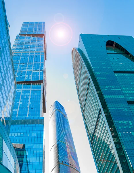 Perspective wide angle view to blue glass building skyscrapers — Stock Photo, Image