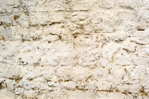 Fond de vieux mur de briques peintes fissurées avec du ciment — Photo