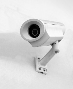 Security camera on the wall clipart