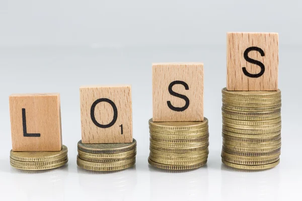 Coin stacks with letter dice - loss — Stock Photo, Image