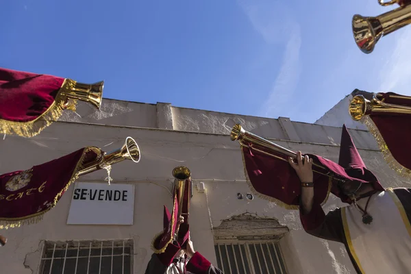 Penitents playing trumpets during Holy week in the good Friday — Stock Photo, Image