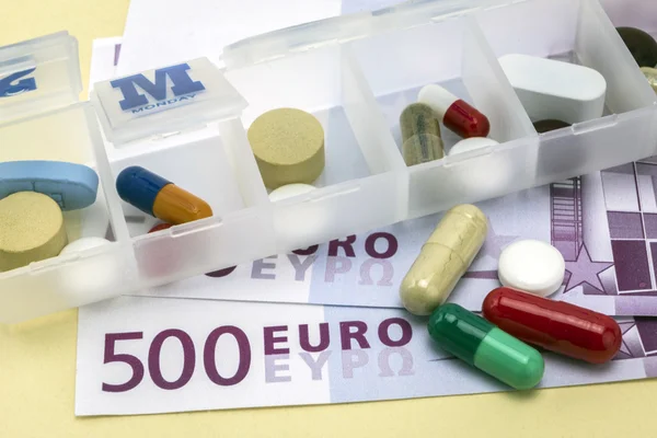 Some pills in a pillbox, daily medication treatment — Stock Photo, Image