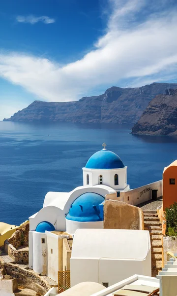 Churches of Oia village under puffy clouds, Santorini — Stock Photo, Image