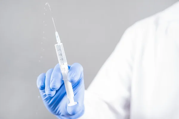 Syringe with a needle, syringe with fluid, — Stock Photo, Image