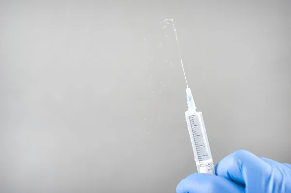 Syringe with a needle, syringe with fluid, — Stock Photo, Image