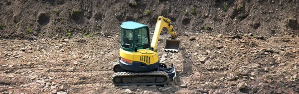 建設中の掘削機の水平方向の写真です — ストック写真
