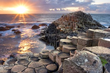 Sunset at Giant s causeway clipart