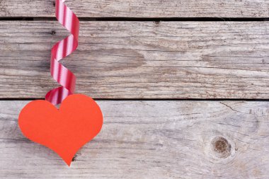 Heart hanging from ribbon