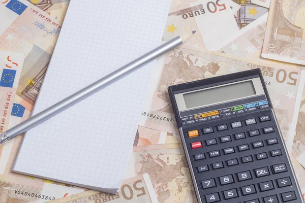 Office supplies over euro notes — Stock Photo, Image