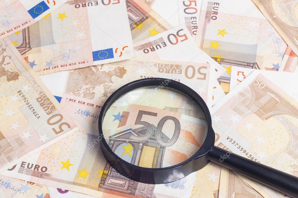 Magnifier over fifty euro notes