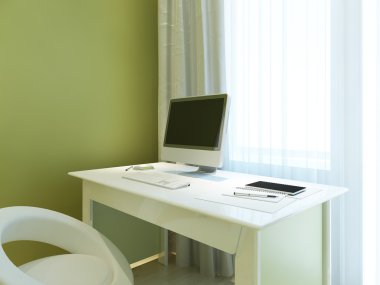 Workplace with mockup monitor on a white table.
