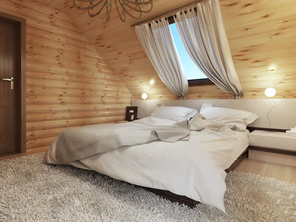 Schlafzimmereinrichtung in einem Holzscheit im Dachgeschoss mit Dachfenster. — Stockfoto