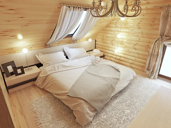 Çatı penceresi ile tavan katında bir günlük yatak odası iç.