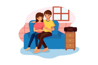 Çift kanepede oturup kablosuz hoparlörden müzik dinliyor.