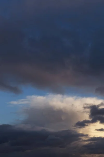 Epic dramatic Storm sky, dark and white big cumulus clouds on blue sky background texture