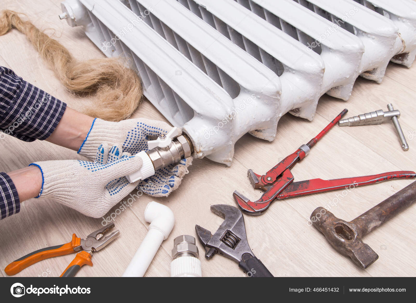 Plumber Hands Repairing Valve Radiator Tools Stock Photo by ©Viktor108