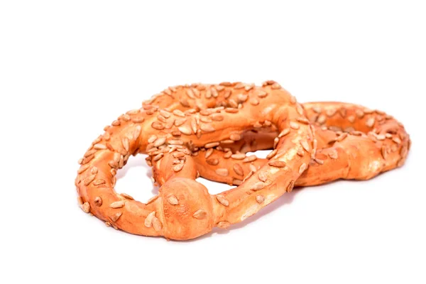 Pretzels with seeds on white — Stock Photo, Image