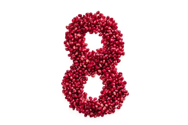 Berries of a pomegranate in the form of eight to the Women's Day — Stock Photo, Image