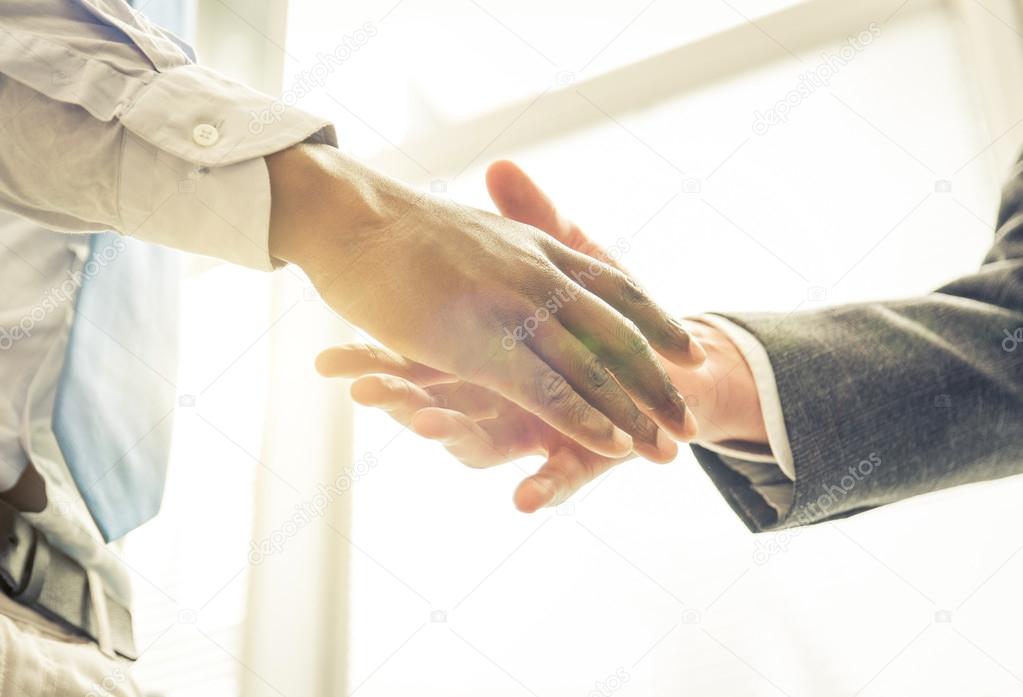 Business handshake. two men reaching an agreement