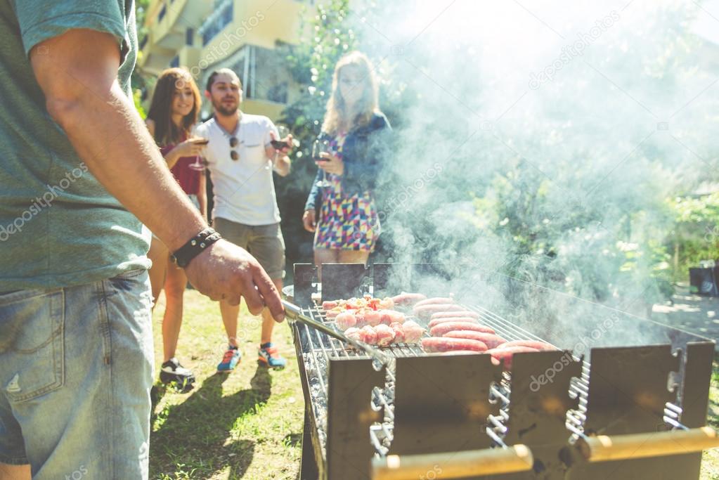 Group of friends making barbeque