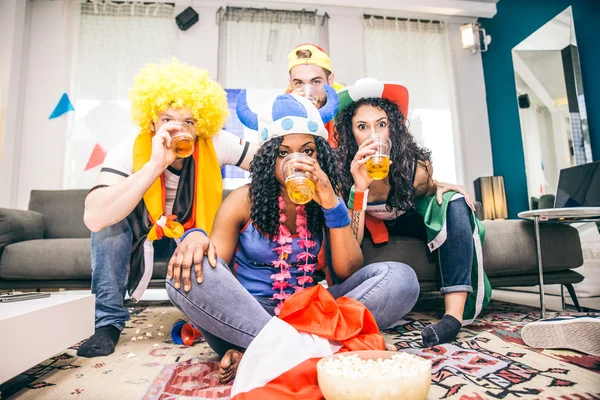 Football fans watching tv Royalty Free Stock Photos