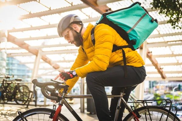 Food delivery service, rider delivering food to clints with bicycle - Concepts about transportation, food delivery and technology