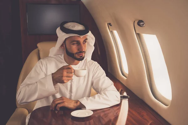 Business man from united arab emirates flying on his private jet to Dubai