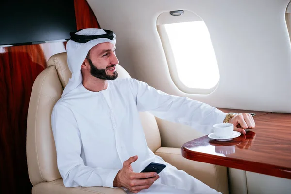 Business man from united arab emirates flying on his private jet to Dubai