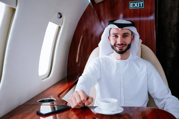 Business man from united arab emirates flying on his private jet to Dubai