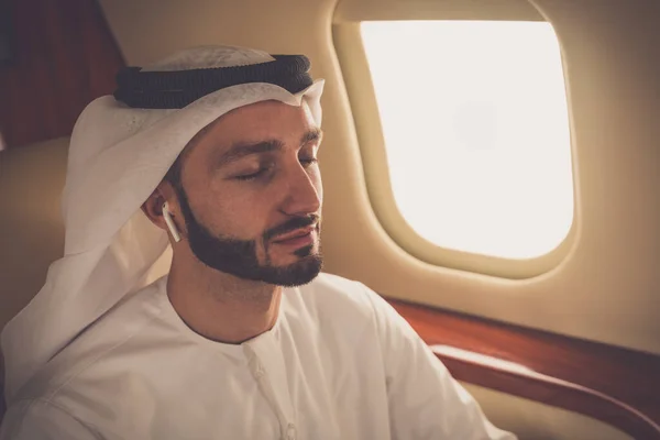 Business man from united arab emirates flying on his private jet to Dubai