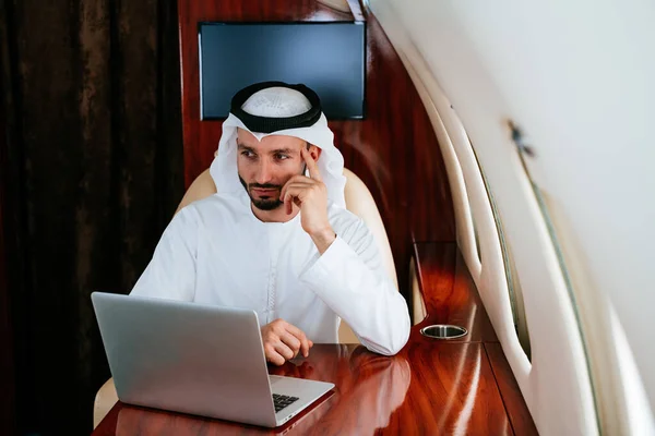 Business man from united arab emirates flying on his private jet to Dubai