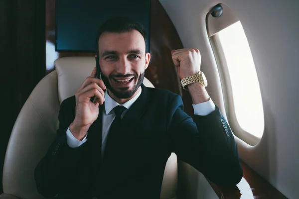 Businessman flying on his private jet. Concept about business, and transportation