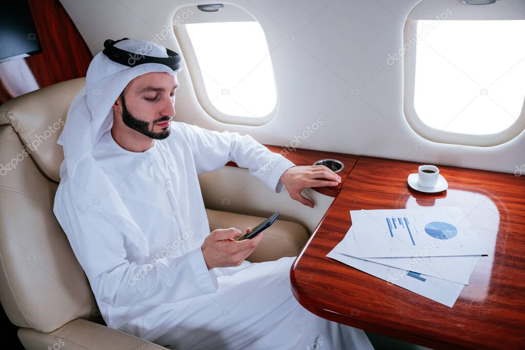 Business man from united arab emirates flying on his private jet to Dubai
