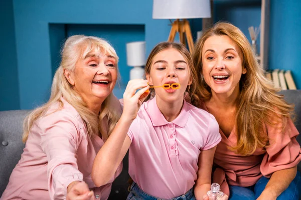 Grandmother, daughter and grandchild together at home, happy domestic life moments - Family having fun, concepts about elderly, mult-generation family and relationship