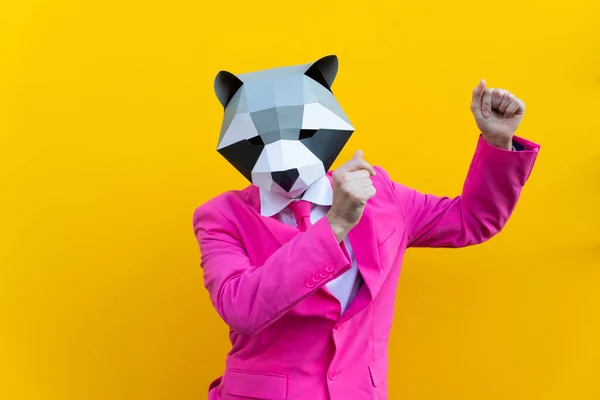 Happy man with funny low poly mask on colored background - Creative conceptual idea for advertising,adult with low-poly origami paper mask doing funny poses