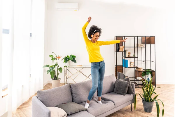 Happy Woman Listening Music Jumping Dancing Sofa Home — Stock Photo, Image