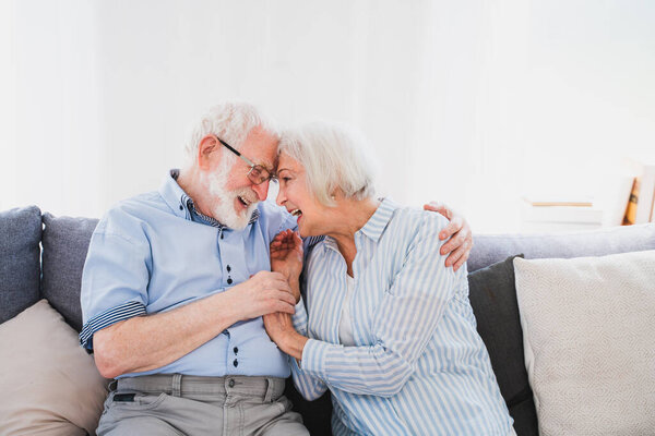 Senior couple together at home, happy moments - Elderly people taking care of each other, grandparents in love - concepts about elderly lifestyle and relationship