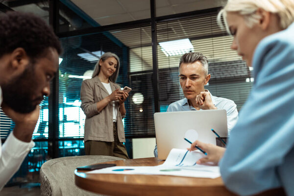 cinematic image of a multiethnic business team. employees working together in a modern office