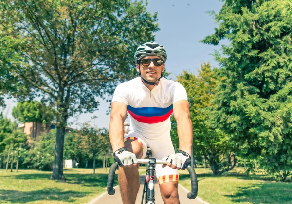 Athlete on his bike — Stock Photo, Image