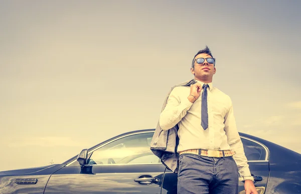 Business man walking away from his car — Stock Photo, Image