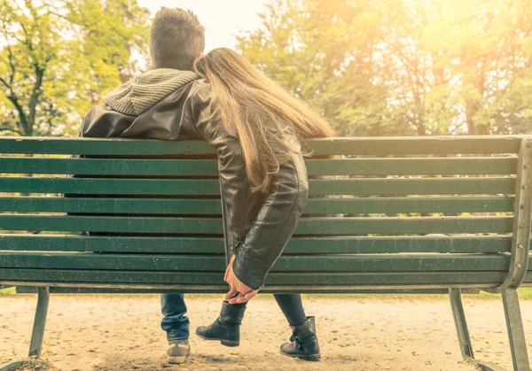 Couple in love on a bench Royalty Free Stock Photos