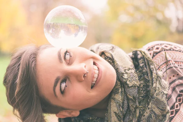 Woman balancing crystal ball — Stock Photo, Image