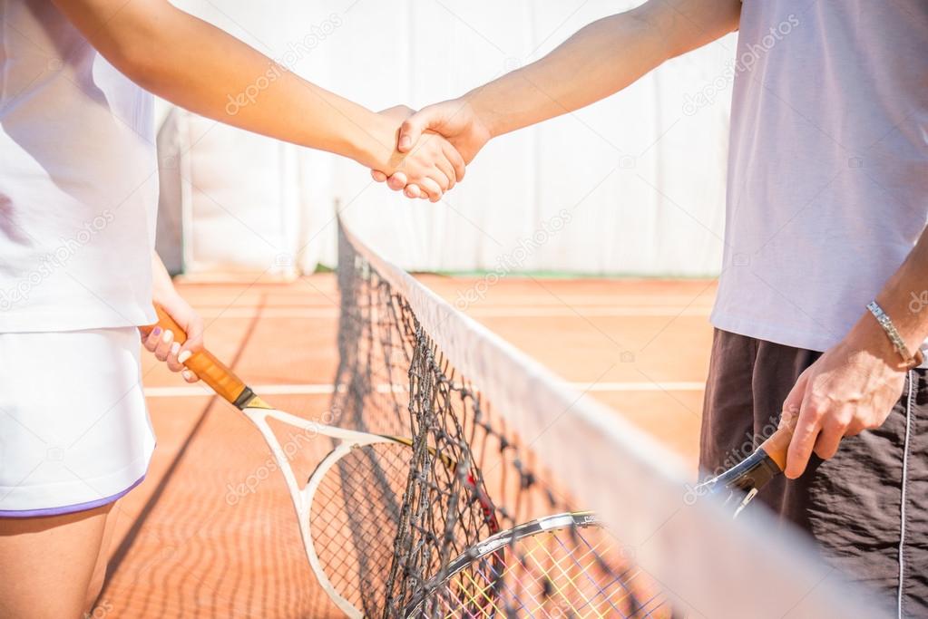 Handshake at tennis court after a match