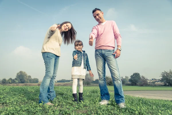 Happy family playing outdoors — Stock Photo, Image