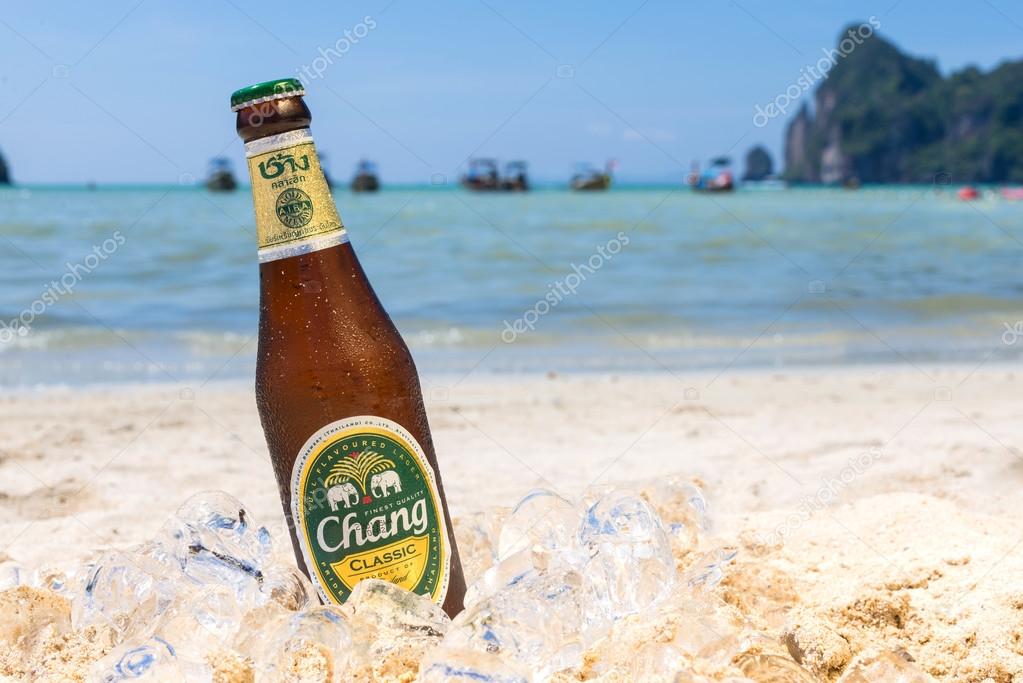 PHI PHI ISLAND,THAILAND - FEBRUARY 27,2015: Chang beer on the beach, a pale lager brewed by ThaiBev, Thailand's largest and one of Southeast Asia's largest beverage companies